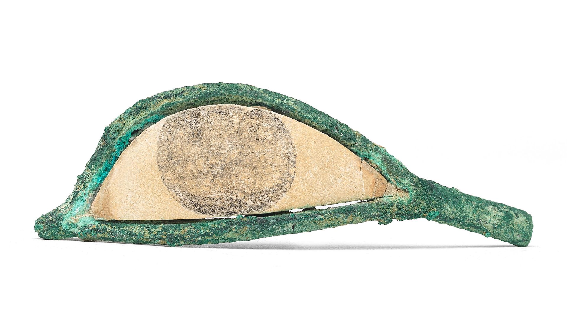 An Egyptian bronze and limestone eye inlay