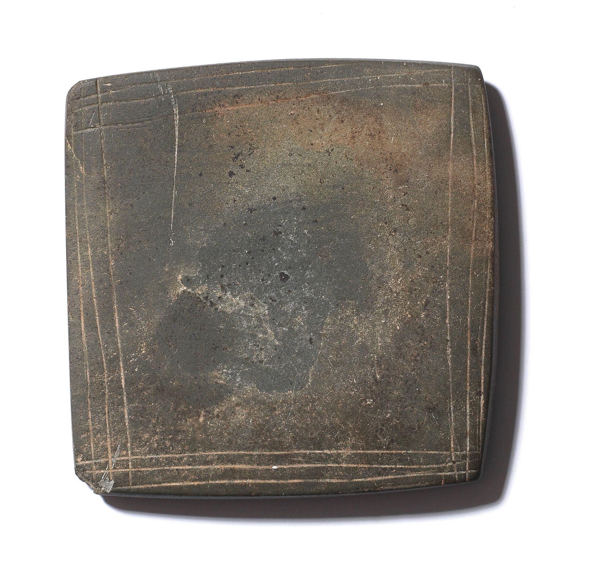 An Egyptian square greywacke palette