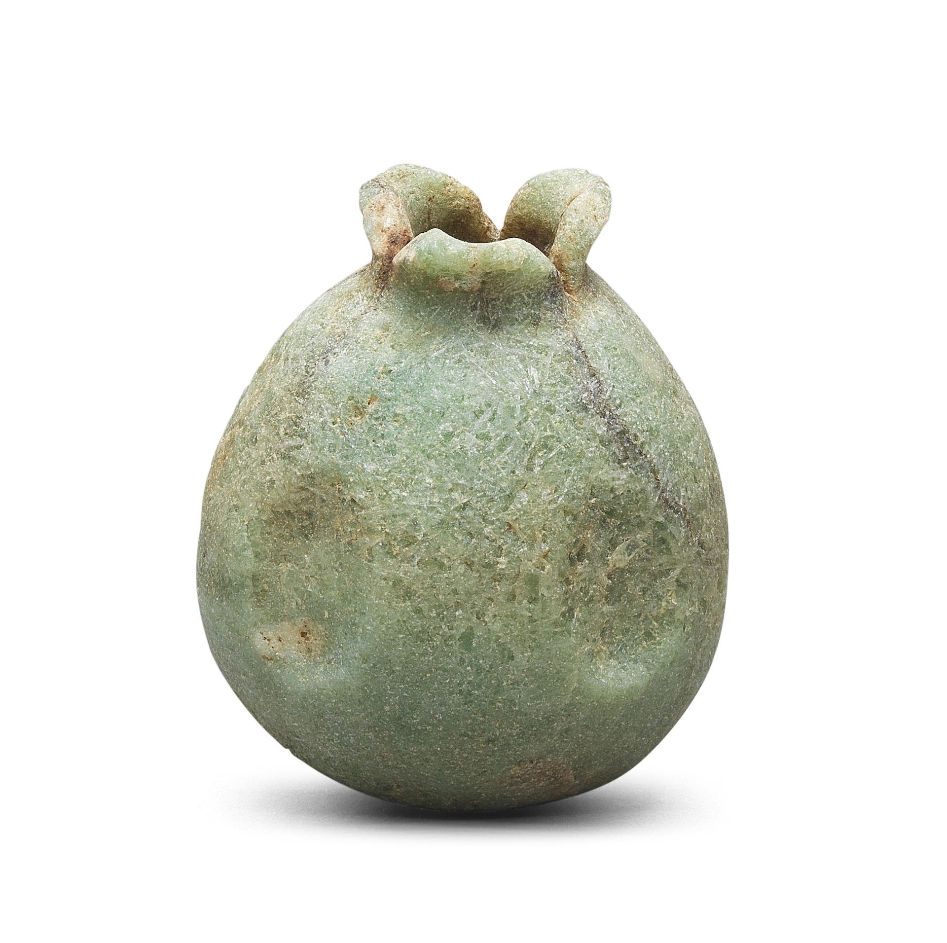 An Egyptian green crystalline hardstone pomegranate vessel