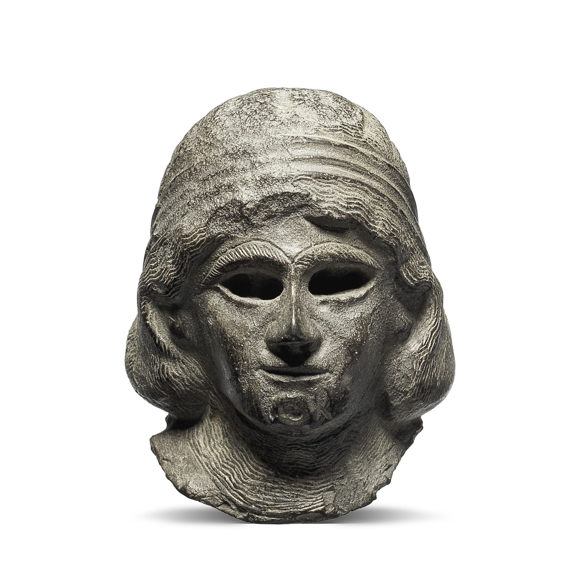 A Western Asiatic grey stone head of a female worshipper