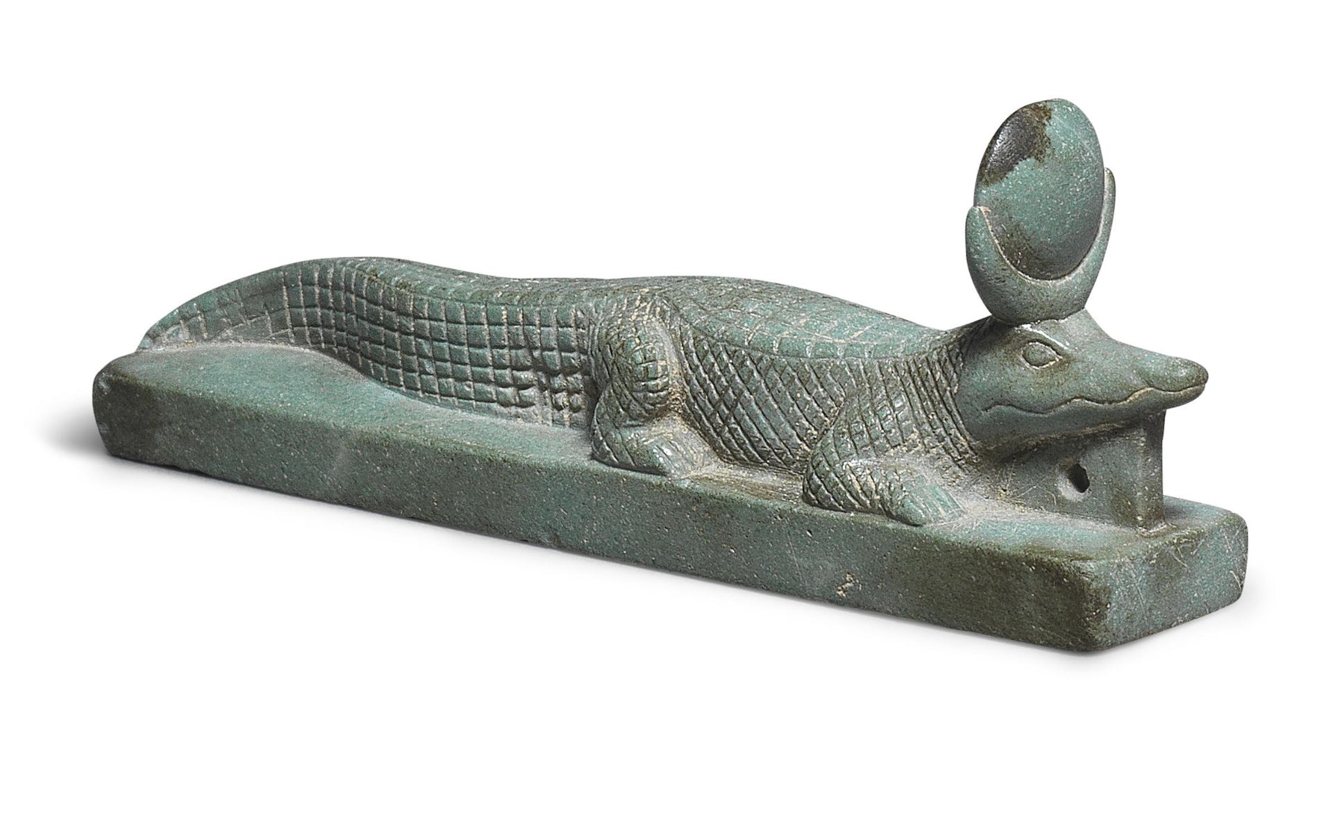 An Egyptian green steatite amulet in the form of the crocodile god Khenty-khety