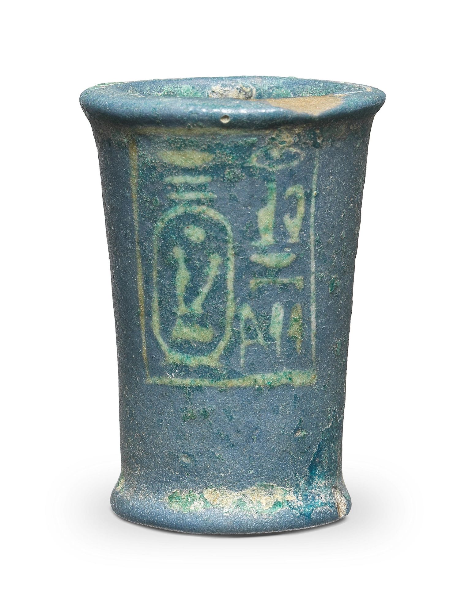 An Egyptian dark blue glazed faience offering vessel naming Seti I