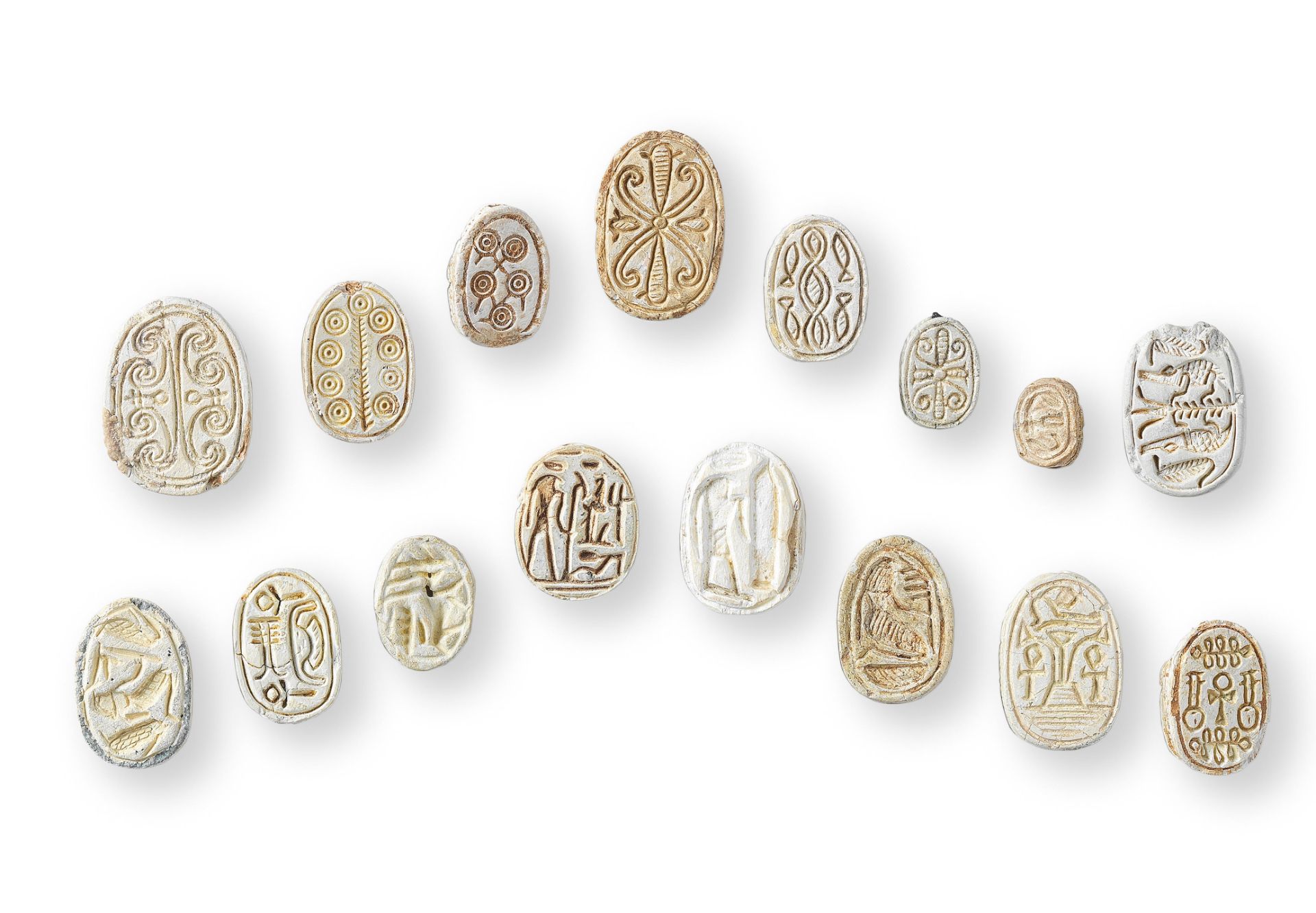 Sixteen Egyptian white steatite scarabs five other inscribed scarabs, 21