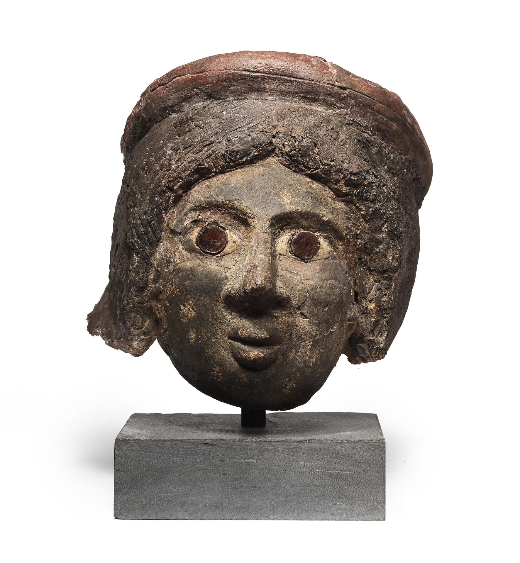 A Romano-Egyptian plaster funerary female head