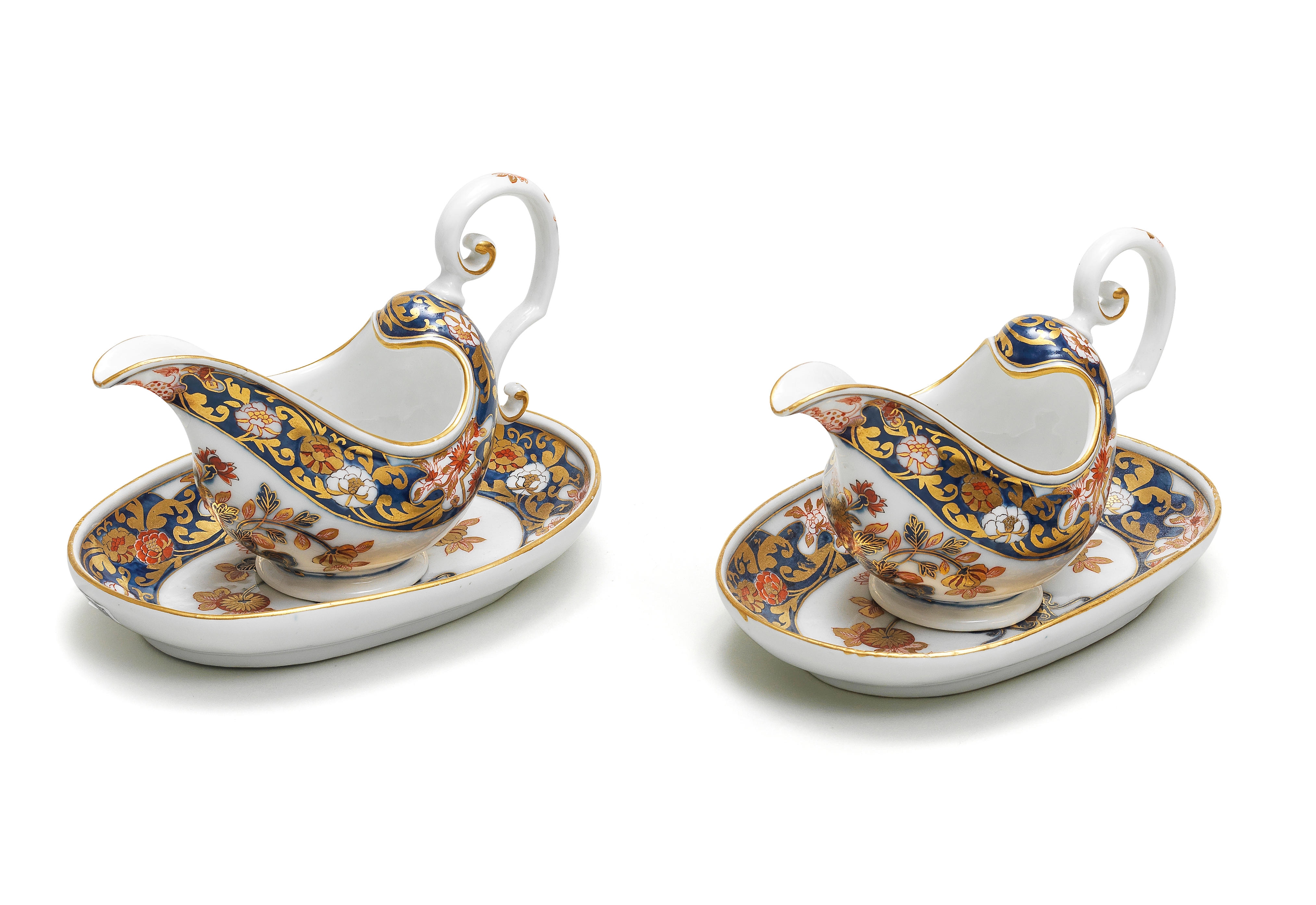 A very rare pair of Meissen Imari sauceboats and oval stands, circa 1740
