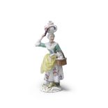 A rare Meissen 'Cris de Paris' figure of the milk and egg seller, circa 1755