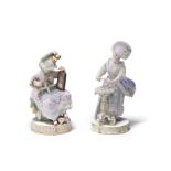 Two Meissen figures of ladies, together with a Meissen figure of a cavalier at a writing desk, la...