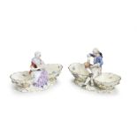 Two Meissen figural double-salts, late 19th century; together with a Meissen group of putti with ...