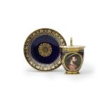 A S&#232;vres blue-ground portrait cup and saucer (tasse &#224; chocolat AB et soucoupe), dated 1...