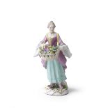 A Meissen 'Cris de Paris' figure of a flower girl, circa 1755