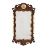 A GEORGE II MAHOGANY AND PARCEL GILT WALL MIRROR