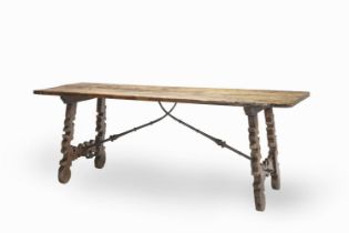 A SPANISH BAROQUE WALNUT, FRUITWOOD AND IRON MOUNTED REFECTORY TABLE Late 17th / early 18th century