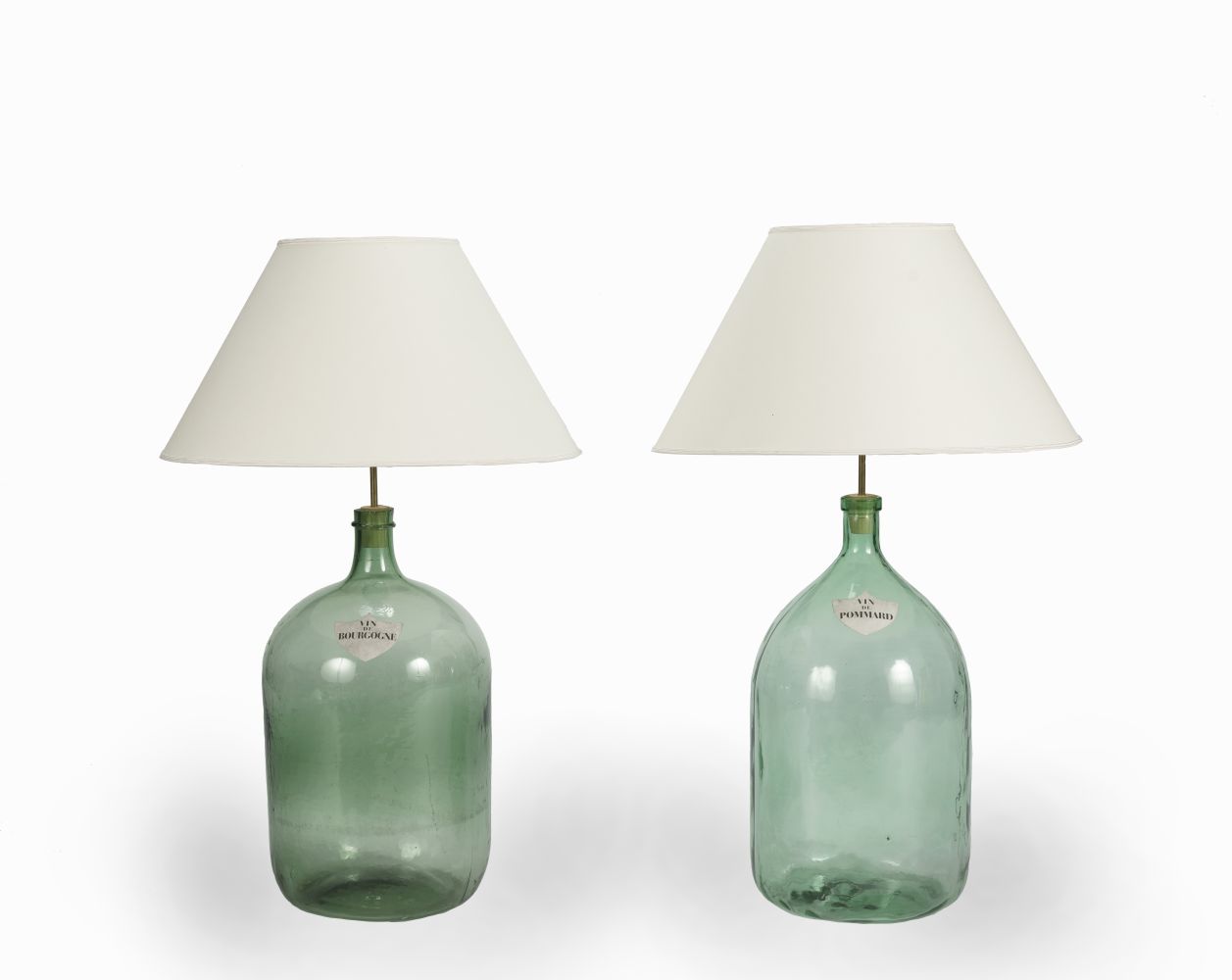 A LARGE NEAR PAIR OF GREEN GLASS LAMP BASES, ADAPTED FROM WINE BOTTLES (2)