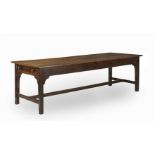 A GEORGE III OAK REFECTORY TABLEEarly 19th century