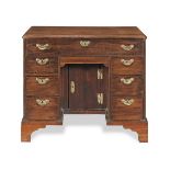 A GEORGE II MAHOGANY KNEEHOLE DESK