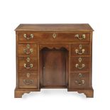 A GEORGE III MAHOGANY KNEEHOLE DESK