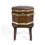 A GEORGE III OCTAGONAL MAHOGANY BRASS BOUND WINE COOLER ON STAND