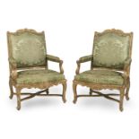 A PAIR OF R&#201;GENCE STYLE LARGE CARVED AND GILTWOOD FAUTEUILS19th / 20th century