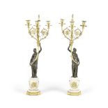 A PAIR OF PATINATED AND GILT BRONZE FIGURAL CANDELABRA Late 19th century in the manner of Pierre...