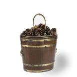 A GEORGE III MAHOGANY AND BRASS BOUND OVAL PEAT BUCKET