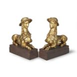 A PAIR OF ITALIAN CARVED GILTWOOD MODELS OF SPHINXESEarly 19th century,