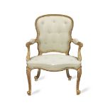 A GEORGE III CARVED GILTWOOD ARMCHAIR In the Louis XV style