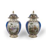 A PAIR OF DRESDEN BALLASTER FORM VASES AND COVERS (2)