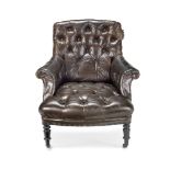 A LEATHER BUTTON BACK UPHOLSTERED LIBRARY ARMCHAIRLate 19th / early 20th century