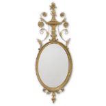 A GEORGE III GILTWOOD OVAL WALL MIRRORLate 18th century