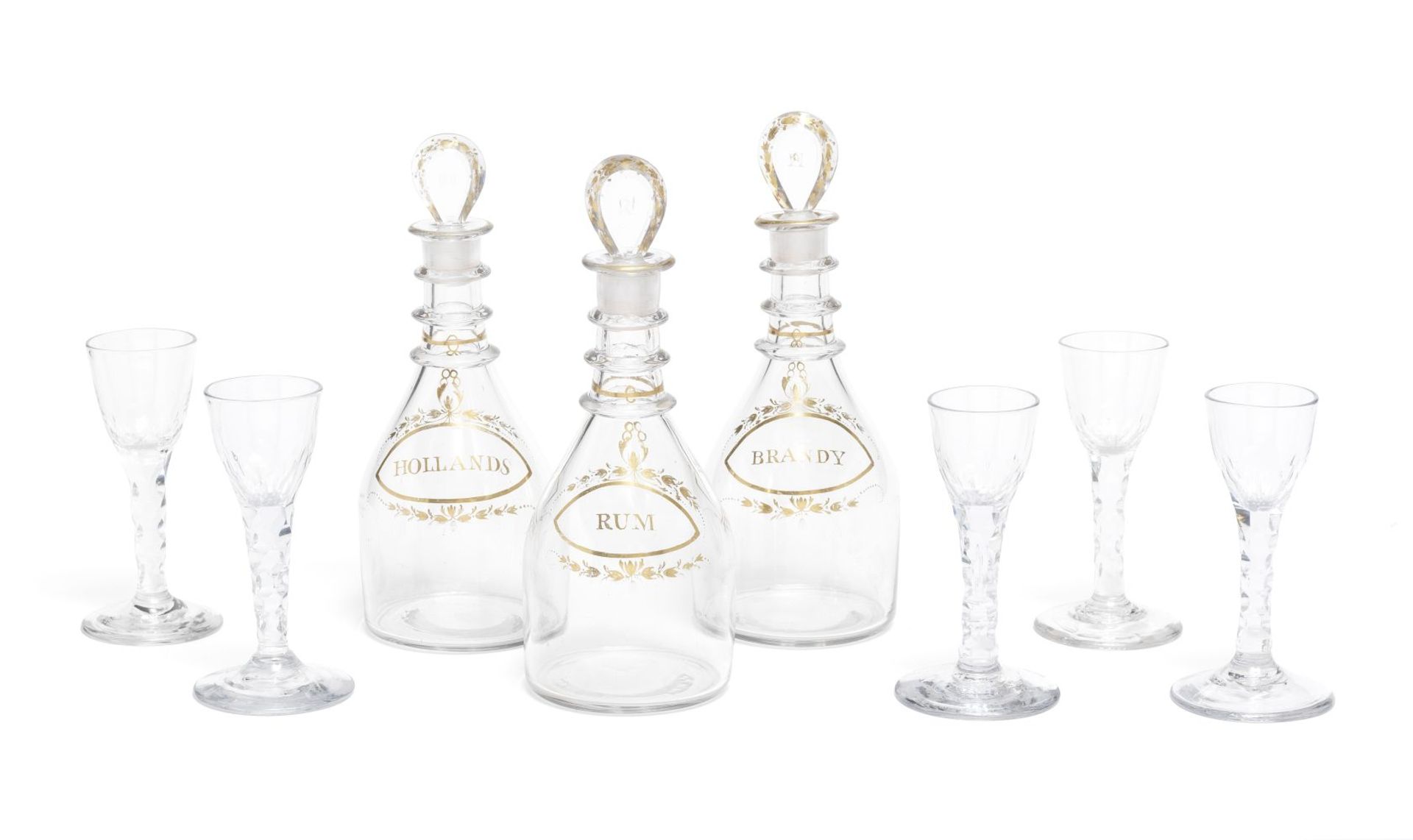 A SET OF THREE GEORGE III GLASS AND GILT HIGHLIGHTED DECANTERS TOGETHER WITH A SET OF FIVE GEORGE...