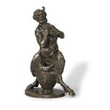 A BRONZE FIGURE OF A FAUN ENTHUSIASTICALLY PLAYING THE PIPES