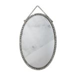 AN IRISH CUT GLASS FRAMED OVAL MIRROR, TOGETHER WITH A CUT GLASS TWIN BRANCH WALL LIGHT Early 20t...
