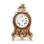 A LOUIS XV STYLE ROSEWOOD MANTEL CLOCK 19th century and incorporating some earlier elements
