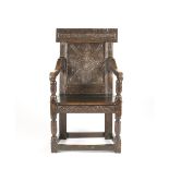 AN OAK PANEL BACK ARMCHAIR17th century