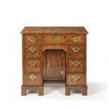 A MID-18TH CENTURY WALNUT KNEEHOLE DESK