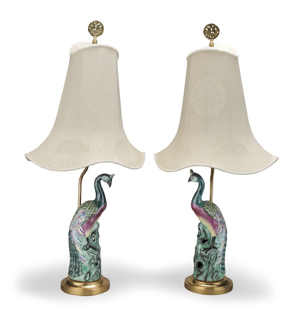 A PAIR OF CHINESE EXPORT FAMILLE ROSE PORCELAIN PEACOCKS MOUNTED AS LAMPS Possibly 18th century a...