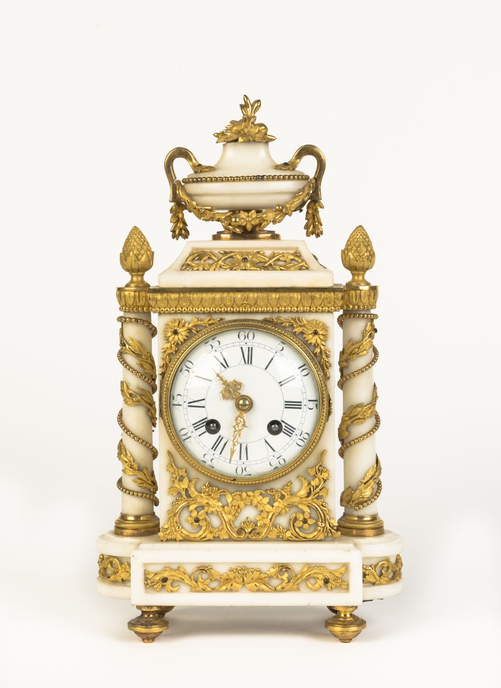 A LOUIS XVI STYLE ORMOLU-MOUNTED WHITE MARBLE MANTLE CLOCK Early 20th century