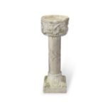 A Venetian carved Istrian stone font possibly 12th/13th century, raised on a carved stone pedesta...