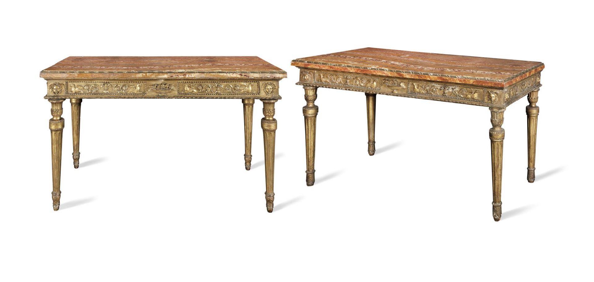 A near pair of Italian late 18th/early 19th century carved giltwood and gilt gesso side tables on...