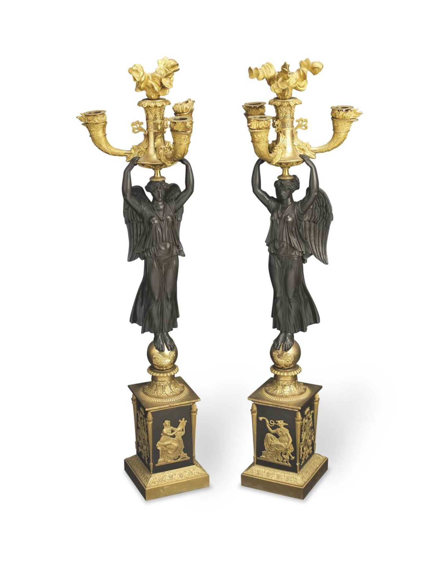 A pair of French Empire gilt and patinated bronze three branch figural candelabra circa 1810 (2)