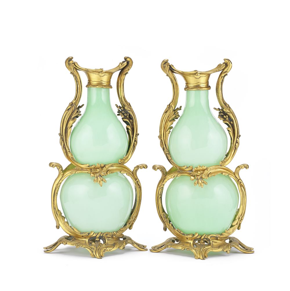 A pair of mid 19th century French gilt bronze mounted and celadon green opaline glass vases in t...