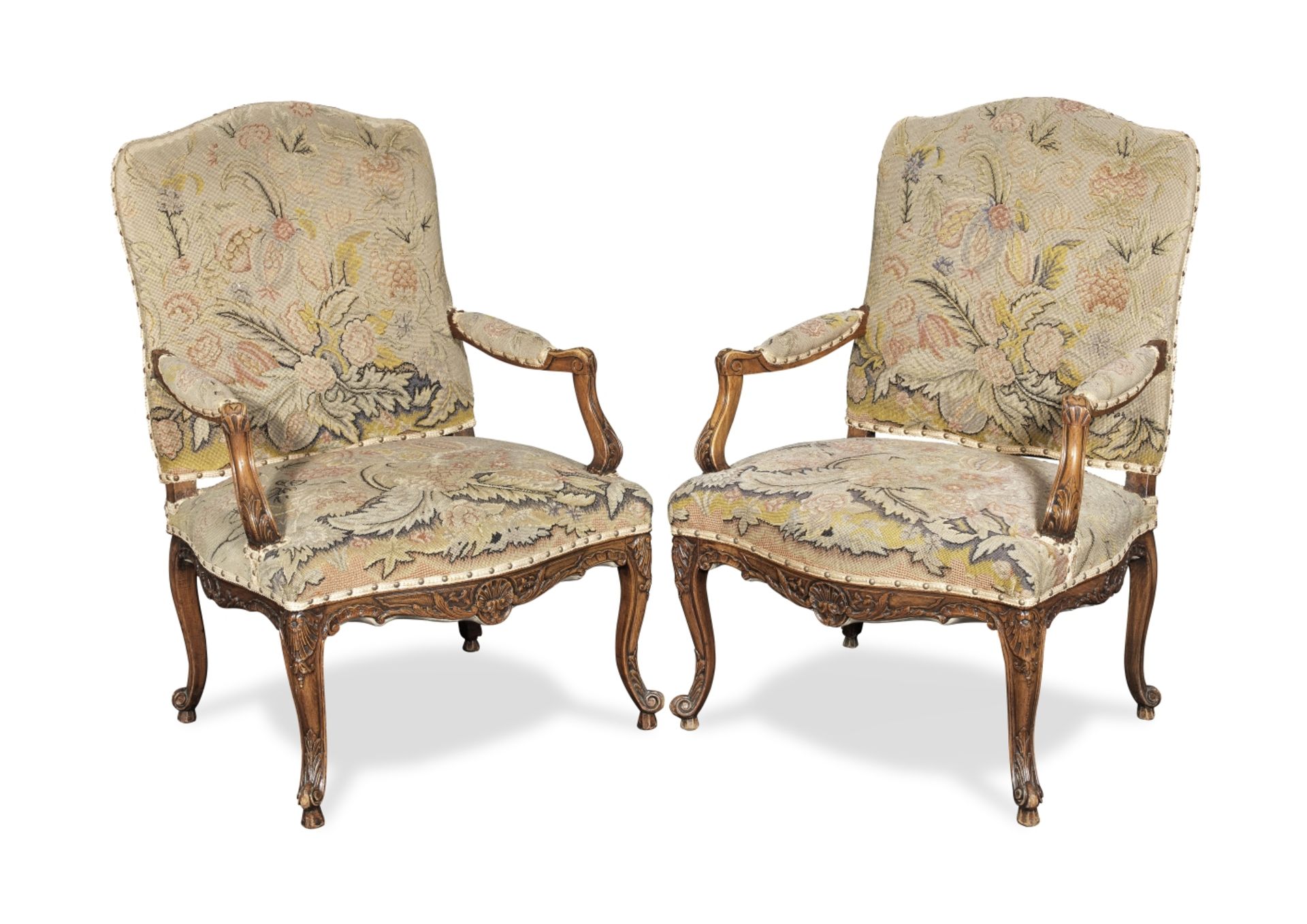 A pair of French stained beech fauteuils in the Regence style (2)