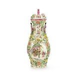 An mid 19th century Canton famille rose and floral encrusted porcelain hall vase and cover
