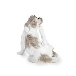 A 20th century Meissen porcelain model of a seated Bolognese hound