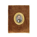 William Page Simpson (British, 1845-1911): An oval enamelled copper portrait miniature of a gentl...