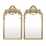 A pair of late 19th century Rococo revival giltwood and gilt composition pier mirrors (2)