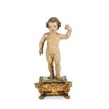 An 18th century Spanish carved and polychrome painted carved wood figure of the Christ child