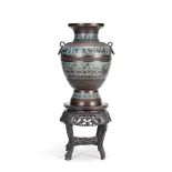 A late 19th/early 20th century champlev&#233; enamelled and patinated bronze urn together with a ...