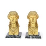 A pair of early 19th century French gilt bronze herm busts of classical female muses in the Empir...