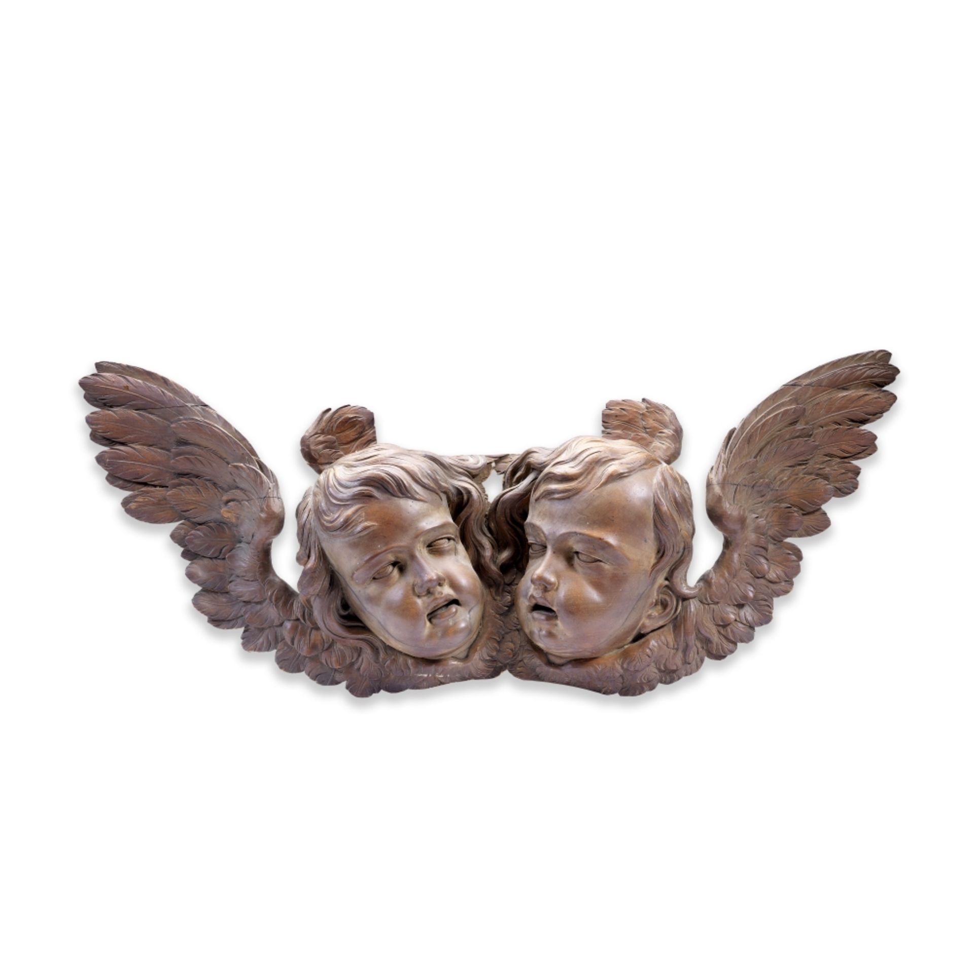 After Grinling Gibbons (Anglo-Dutch, 1648-1721): A carved fruitwood applique of two puttos' heads...